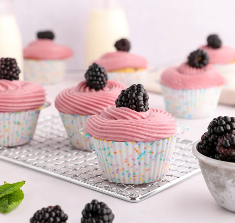 Colorful reusable silicone cupcake liners filled with baked cupcakes
