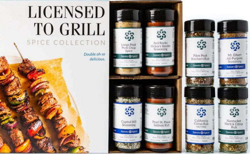 One of the Best Gifts for a Man: Box labeled Licensed to Grill, eight spice jars, and skewered grilled meat and vegetables.