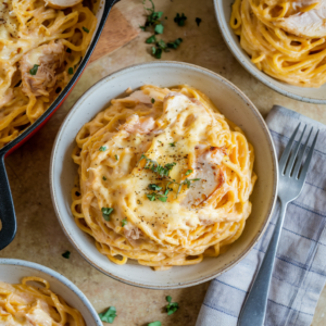 Overhead view of creamy baked chicken spaghetti in a small baking dish