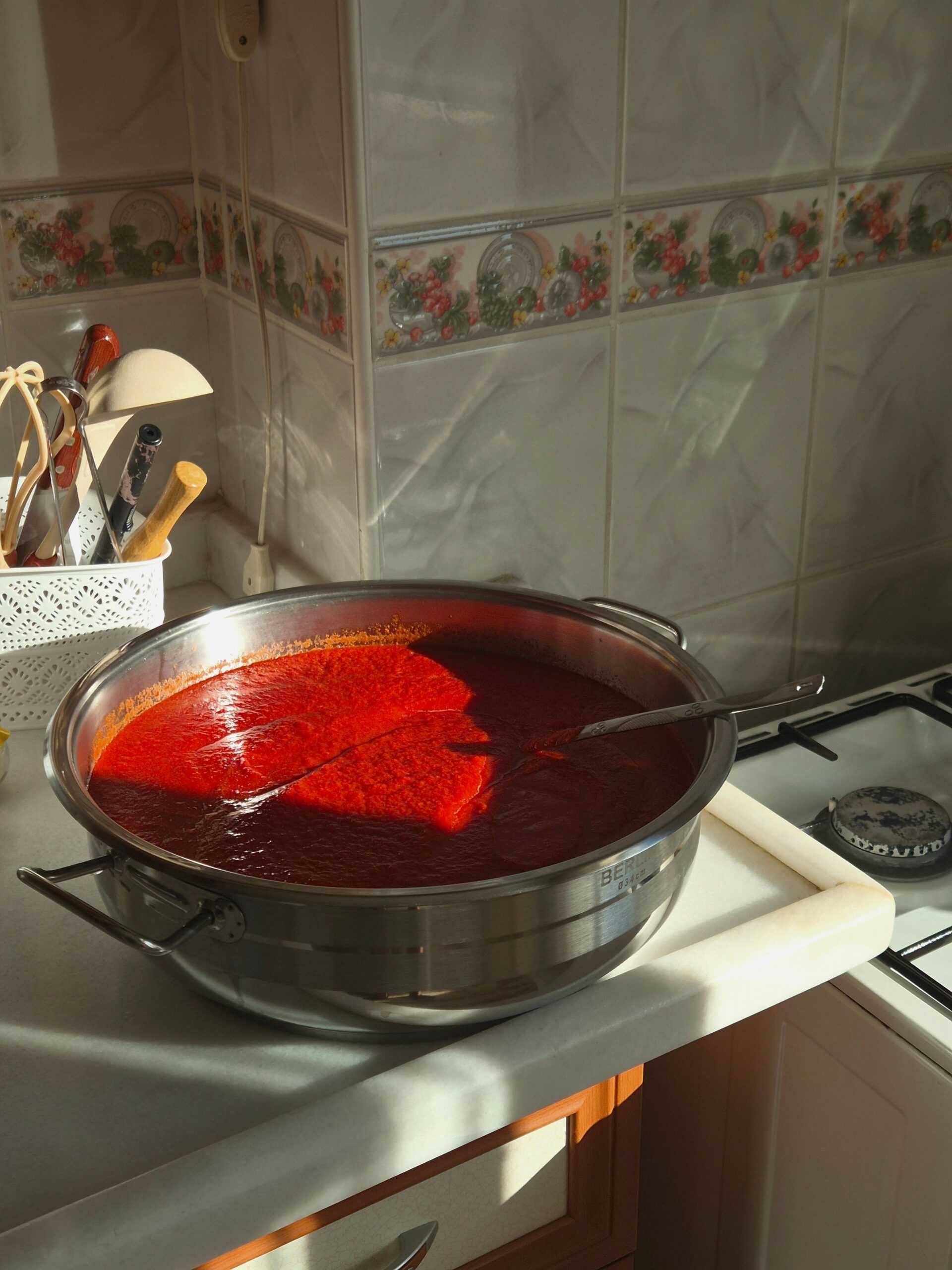 Fresh tomato sauce simmering in a pot on the stove